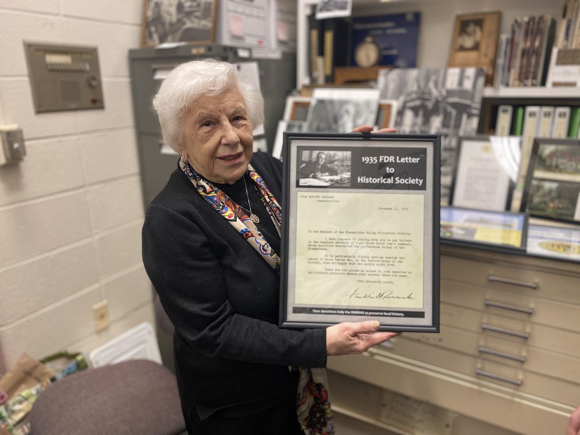 Photo: Sylvia Meyers, volunteer at Roxborough-Manayunk-Wissahickon Historical Society, holds a letter to the society from the 32nd U.S. President Franklin Delano Roosevelt