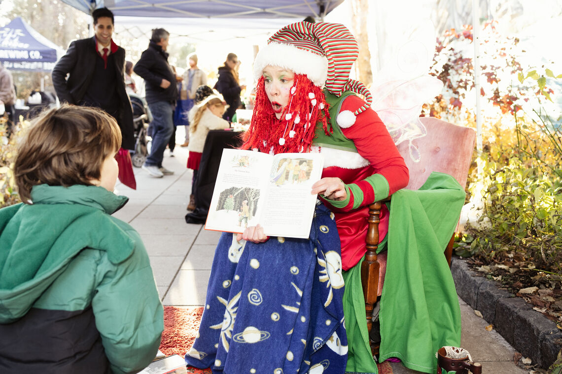 Photo: Flyleaf the Book Fairy shared stories with young listeners. Photo Credit | Studio Luminoso