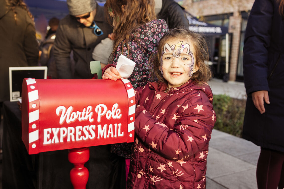 Photo: Many children mailed their Christmas lists to Santa with the North Pole mailbox. Photo Credit | Studio Luminoso